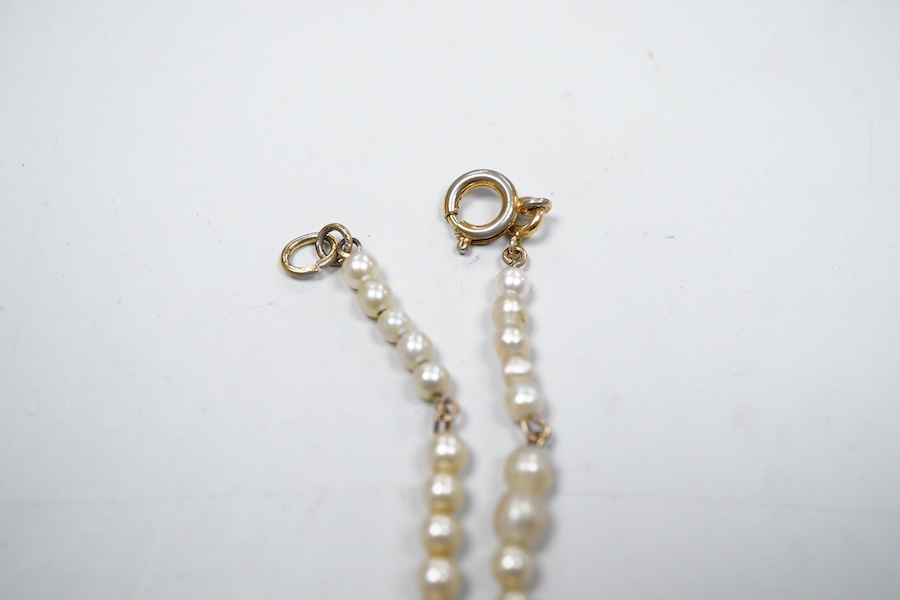 An Arts & Crafts gem-set and pearl necklace, circa 1900, composite, set with variously cut stones including citrine, amethyst, peridot, tourmaline and zircon, and pearls, length 42cm, pearls untested, Condition: good, ty